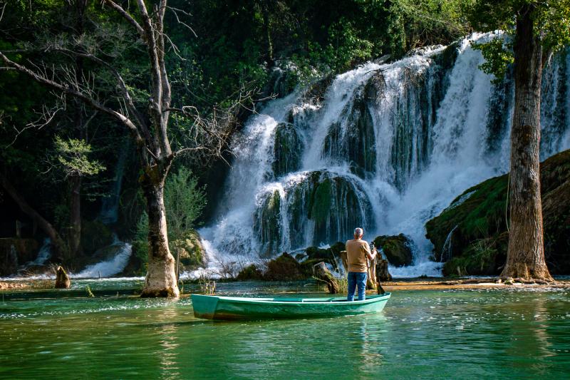 Do a boat ride underneath Kravice waterfalls